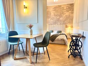 Postel nebo postele na pokoji v ubytování Le Carrousel - Au Coeur du centre & Wifi