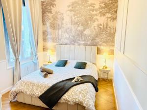 Postel nebo postele na pokoji v ubytování Le Carrousel - Au Coeur du centre & Wifi