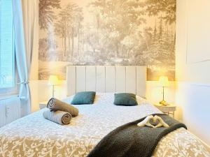 Postel nebo postele na pokoji v ubytování Le Carrousel - Au Coeur du centre & Wifi + 10 fotografií