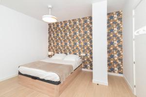 Ένα ή περισσότερα κρεβάτια σε δωμάτιο στο Flowers Houses