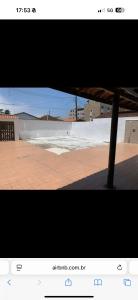a screenshot of a picture of a view of a patio at Casa pé na areia in Mongaguá +3 photos