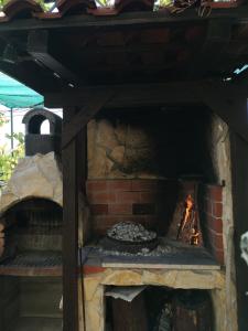 a brick oven with a fire inside of it at Studio Banjol 5071a in Rab