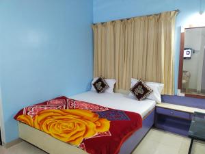 Ένα ή περισσότερα κρεβάτια σε δωμάτιο στο Sunrise guest house