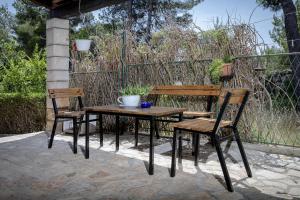 a table and two chairs and a table and a bench at Apartments by the sea Zavala, Hvar - 2061 in Zavala