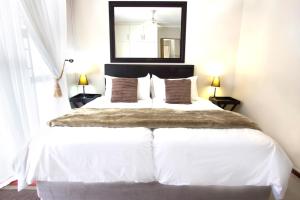 Postel nebo postele na pokoji v ubytování Julinas Guesthouse