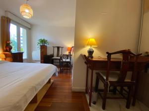 En eller flere senge i et værelse på Grand Appartement F4 bien situé pour visiter Paris