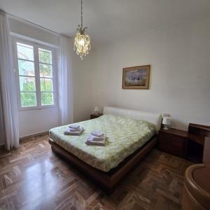 Postel nebo postele na pokoji v ubytování Lanfranco & Anna house