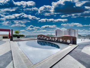 a swimming pool on the roof of a building at AZ 3Rooms Apartment at De Centrum Bangi-Putrajaya in Kajang