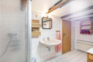 a bathroom with a sink and a shower at Ferienhaus Neuenrade in Neuenrade