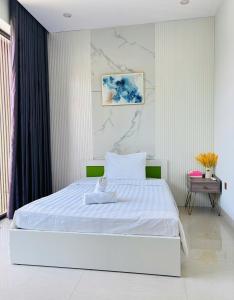 Ένα ή περισσότερα κρεβάτια σε δωμάτιο στο Sunrise Homestay with 4 Bedrooms