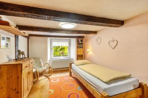 a bedroom with a bed and a window at Ferienhaus Neuenrade in Neuenrade