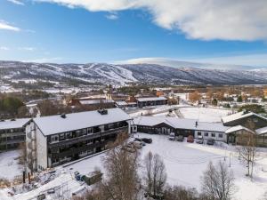 an aerial view of a town with snow covered buildings at Geilo Town Centre - Apartment with a Superb Location and walking Distance to Everything in Geilo