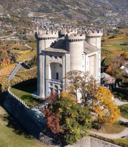 an aerial view of a castle on a hill at Moulins 57 in Aymavilles