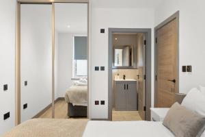 Ένα ή περισσότερα κρεβάτια σε δωμάτιο στο Luxury London Guest House +3 φωτογραφίες