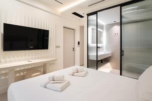 Postel nebo postele na pokoji v ubytování Kivos Luxury Apartments