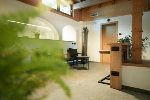 a living room with a table and a chair at Camping Marmolada Malga Ciapela - Glamping Experience in Malga Ciapela +54 photos