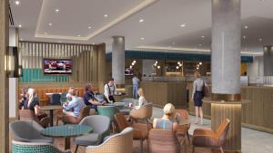 eine Lobby mit Leuten, die an Tischen sitzen in der Unterkunft Maldron Hotel Croke Park in Dublin + 16 Fotos