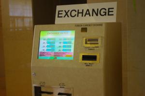 an atm machine with an exchange sign on it at Hotel Keihan Universal Tower in Osaka