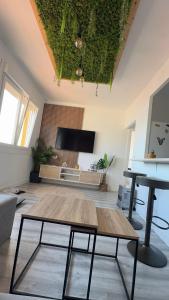 a living room with a table and a couch at El nido de la gaviota in Moaña