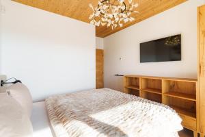 Ένα ή περισσότερα κρεβάτια σε δωμάτιο στο Monte Vista Luxury Chalet