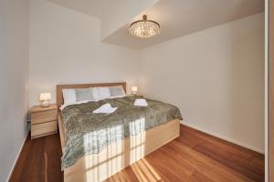 Ένα ή περισσότερα κρεβάτια σε δωμάτιο στο Bern 4, Modern City Apartment Bern, big privat terrace