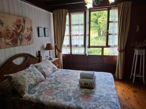 Ένα ή περισσότερα κρεβάτια σε δωμάτιο στο casa PUMARADA