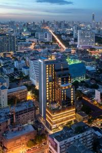 an aerial view of a city at night at Amara Bangkok Hotel in Bangkok