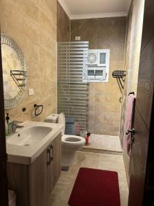a bathroom with a sink and a toilet at Quiet HOME in Hurghada
