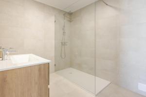 a bathroom with a sink and a shower at Vale Furado Sea & Nature - BY SCH - B in Vale Furado +14 photos