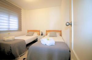 Postel nebo postele na pokoji v ubytování Mogador beach - HOME RENT MALAGA