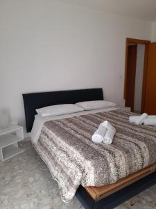 Postel nebo postele na pokoji v ubytování Belvedere da Madia