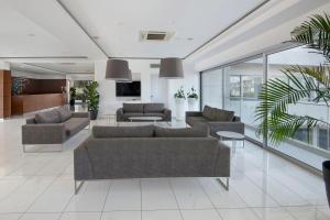a living room with two couches and a table at UC Hall Residence in Nicosia