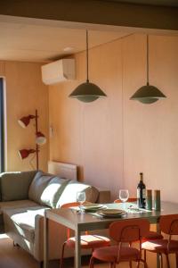 a living room with a couch and a table at Brzozowy Rożnów in Rożnów