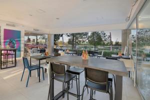 a dining room with a large table and chairs at UC Hall Residence in Nicosia