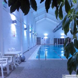 a large swimming pool in a large building at Seaglass, The Bay - Filey Ground Floor Step Free Easy Access and Parking in Filey