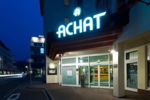 a walmart sign on the side of a building at ACHAT Hotel Neustadt an der Weinstraße in Neustadt an der Weinstraße