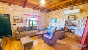 a living room with a couch and a table at Villa Kamenjarka in Široki Brijeg +33 photos