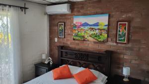 Ένα ή περισσότερα κρεβάτια σε δωμάτιο στο Lombardia