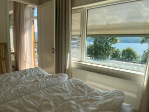 a bedroom with a bed in front of a window at Åre Stay - VM huset centralt i Åre in Åre