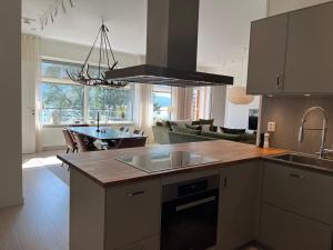 a kitchen with a sink and a counter top at Åre Stay - VM huset centralt i Åre in Åre