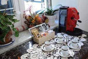 a group of cups and saucers on a table at La Cascata in Amalfi