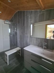 a bathroom with a sink and a shower at Maison sur Ile de Noirmoutier in LʼÉpine +5 photos