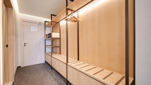a walk in closet with wooden walls and shelves at Hotel Complex SamElyon in Samokov