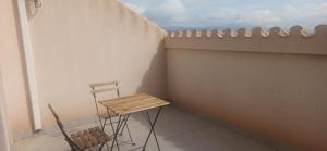 a table and two chairs sitting on a balcony at Casa Carmen in Serón
