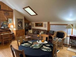 a living room with a table and a couch at Vacation Rental with Spa and Pool on Winery near Healdsburg, California in Ingram