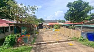 a street in a village with at Chamim Apartments Koh Lanta ชามิม in Phra Ae beach