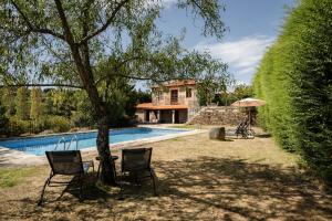 a villa with a swimming pool and a house at Casa de Sao Miguel Douro in Armamar