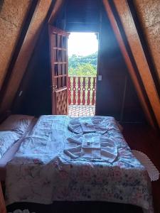 Postel nebo postele na pokoji v ubytování Recanto Mauá - Chalé Amarílis