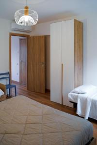 Postel nebo postele na pokoji v ubytování GUBBIO LIVING - By Angeloni