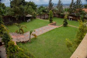 an aerial view of a garden with grass and trees at Jebel Hotel & Lounge Buloba in Kampala